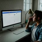 Online business man with phone and computer